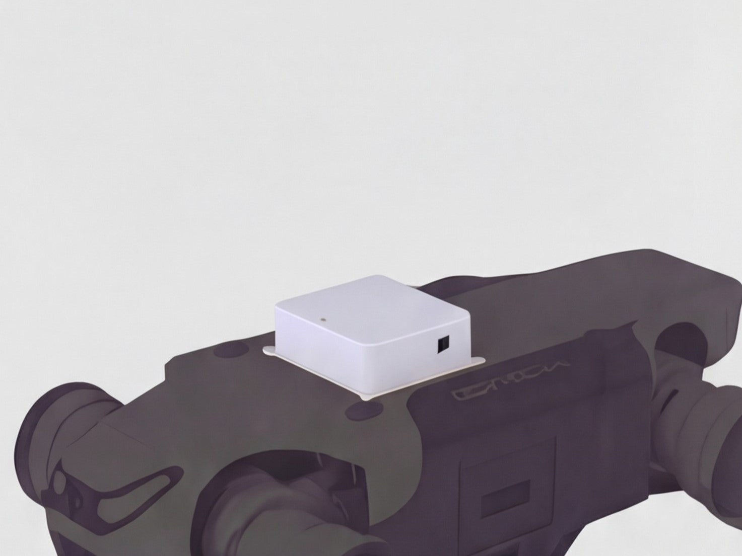 A white rectangular DEEP Robotics Lite3 Venture Payload module mounted on the back of a dark grey DEEP Robotics Lite3 quadruped robot. The module features a small indicator light and a port, signifying its role as an entry-level expansion for basic navigation, education, and early-stage development tasks. It enables features like object recognition and obstacle avoidance through integrated ultrasonic radars and a wide-angle camera.