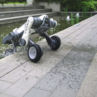 A DEEP Robotics Lynx M20 Pro wheel-legged quadruped robot partially submerged in a pond, demonstrating its IP66 water resistance and robust design for industrial inspection and autonomous navigation in complex outdoor and hazardous environments. The robot features both wheels and articulated legs, and its advanced sensors like LiDAR enable 3D mapping and obstacle avoidance.