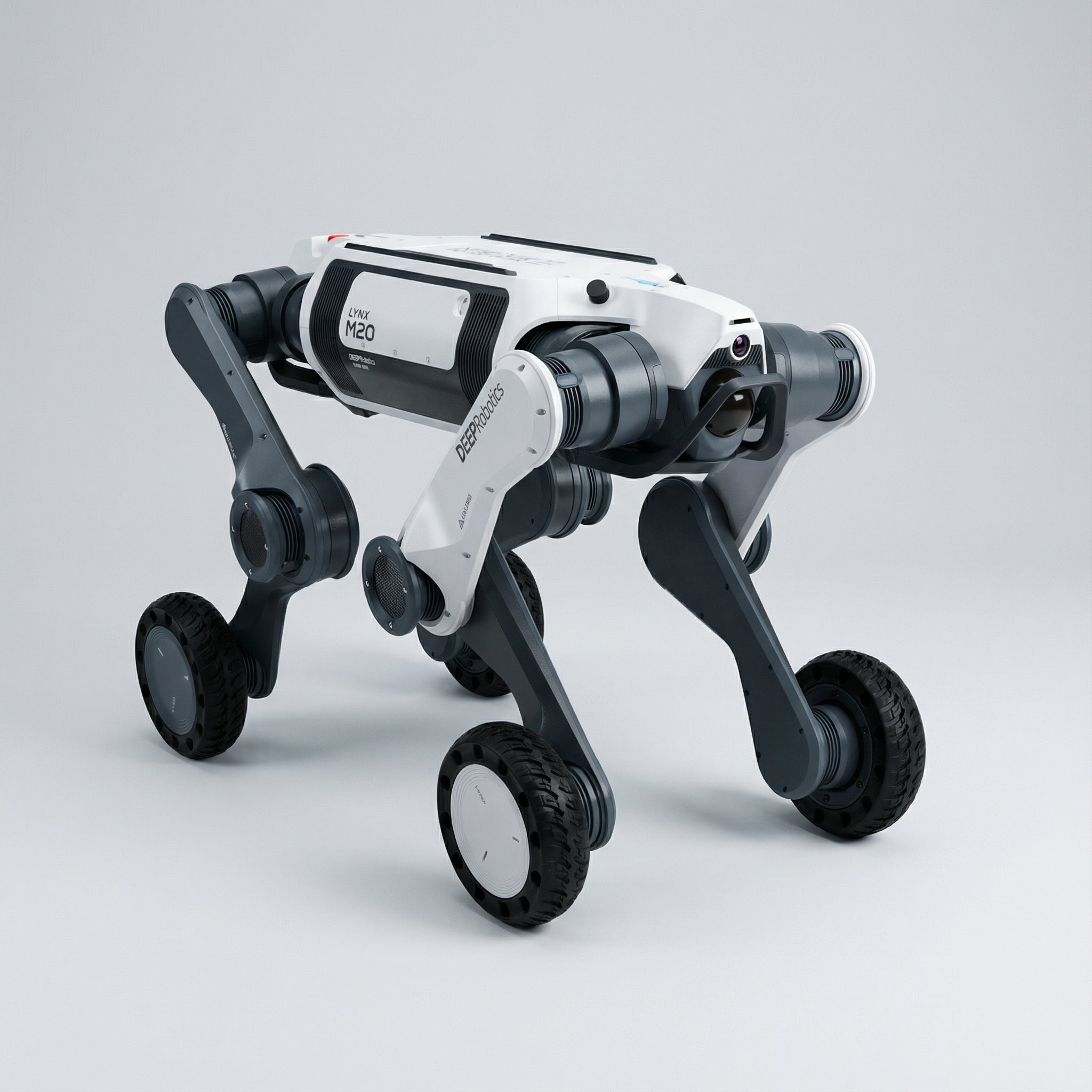A DEEP Robotics Lynx M20 Pro, a white and dark grey industrial wheeled-legged quadruped robot, stands ready for operation. It features a hybrid design combining wheels for speed and articulated legs for agility, equipped with sensors like LiDAR and cameras for autonomous navigation and obstacle avoidance in extreme, unstructured environments.