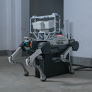 A DEEP Robotics X30 Pro quadruped robot is auto-charging on a charging dock. The robot is equipped with an HD camera and an acoustic camera, performs autonomous industrial inspection. This rugged robot is designed for navigating complex and hazardous environments, utilizing multi-sensor fusion with LiDAR and RTK for precise localization and obstacle avoidance, making it ideal for surveillance and data collection in various industrial applications.
