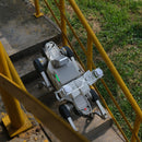 DEEP Robotics X30 Pro quadruped robot performing an industrial inspection, autonomously climbing concrete stairs with yellow railings. The robot is equipped with an HD camera and an acoustic imager, utilizing LiDAR and multi-sensor fusion for navigation in complex and hazardous environments.