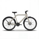A sleek, light grey TASOW electric commuter bike, featuring a quiet and low-maintenance belt drive system, powerful hydraulic disc brakes, and integrated lights. This urban e-bike is designed with a minimalist frame and a rear hub motor, making it ideal for efficient city riding and daily commutes.